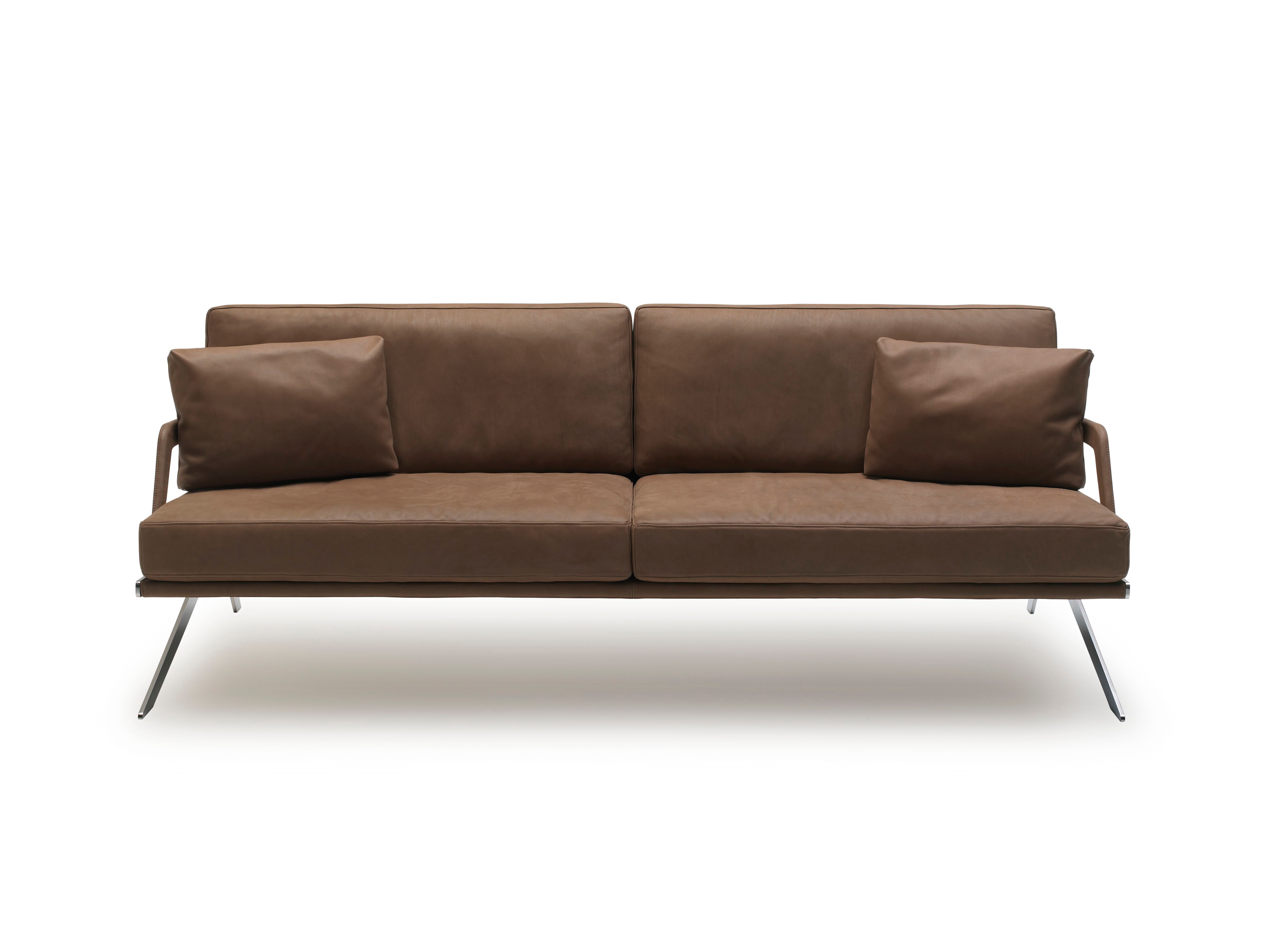 A low leather sofa on a steel frame